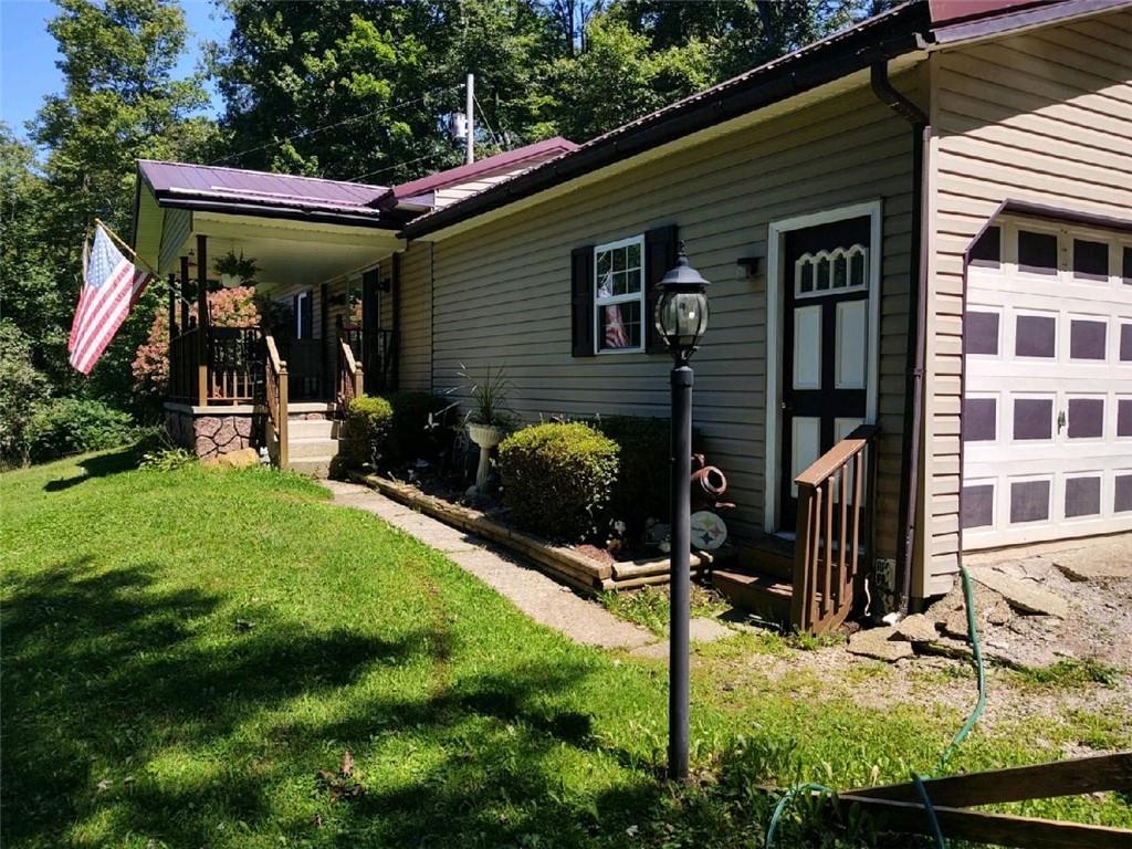 228 Summer Road Rural Valley, PA 16249 - Photo 3 of 25 a view of a house with backyard and porch