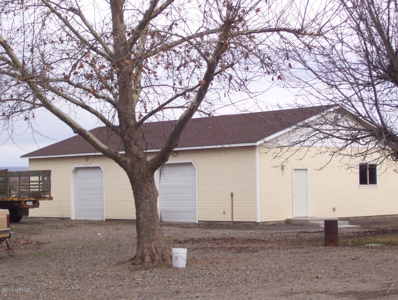 166902 West Johnson Road Prosser, WA 99350 - Photo 23 of 29 a view of a house with a snow and a tree