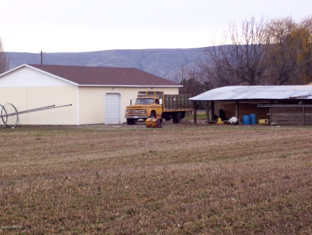 166902 West Johnson Road Prosser, WA 99350 - Photo 4 of 29 a view of house with outdoor space and car parked