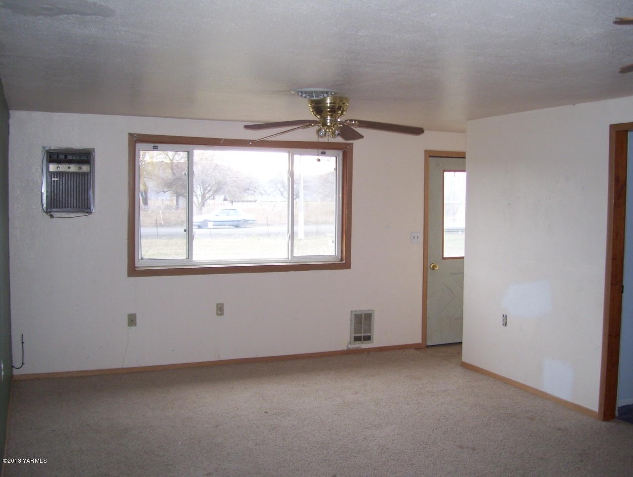 166902 West Johnson Road Prosser, WA 99350 - Photo 7 of 29 a view of an empty room with a window