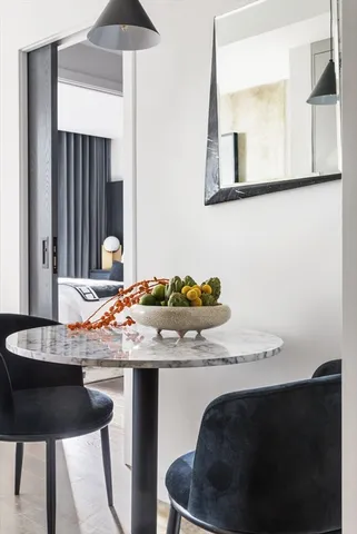 a room with a table and chairs