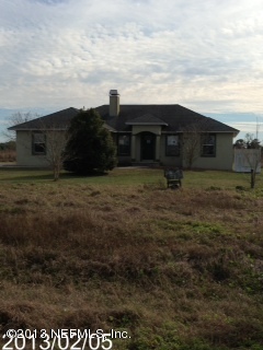 8400 F Reid Road Hastings, FL 32145 - Photo 1 of 13 a view of house with backyard