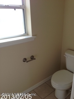 8400 F Reid Road Hastings, FL 32145 - Photo 13 of 13 a bathroom with a toilet and a window