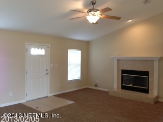 8400 F Reid Road Hastings, FL 32145 - Photo 3 of 13 a view of empty room with a fireplace