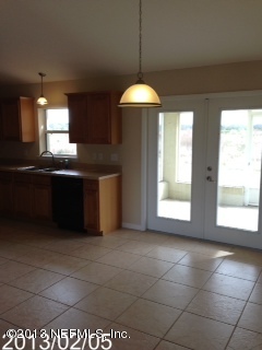 8400 F Reid Road Hastings, FL 32145 - Photo 4 of 13 a kitchen with granite countertop a sink and a stove