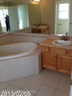 8400 F Reid Road Hastings, FL 32145 - Photo 10 of 13 a bathroom with a sink and a mirror