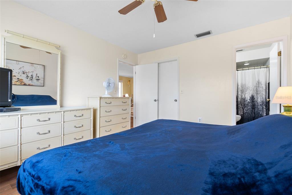 4036 Davit Drive New Port Richey, FL 34652 - Photo 34 of 64 a bedroom with a large bed and a dresser