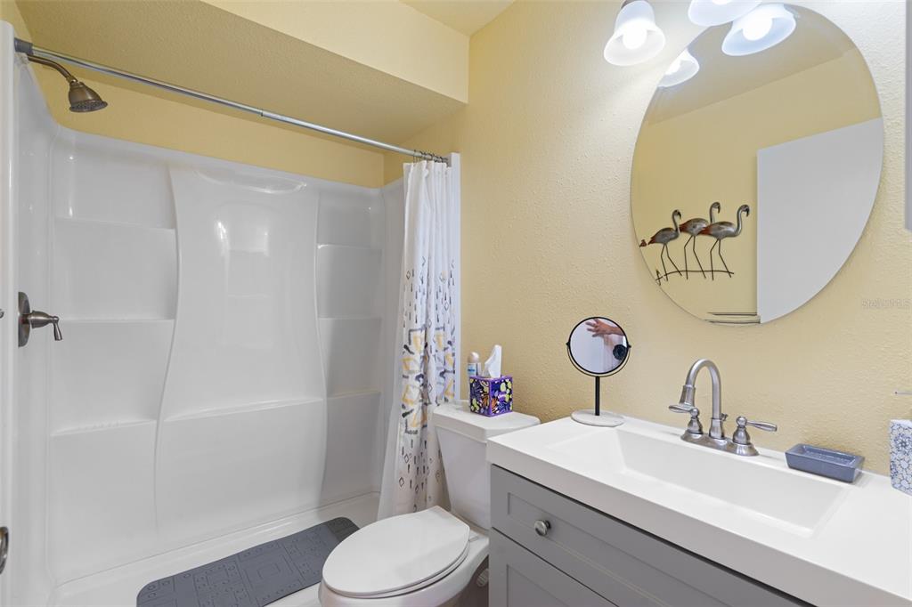 4036 Davit Drive New Port Richey, FL 34652 - Photo 40 of 64 a bathroom with a sink vanity mirror and toilet