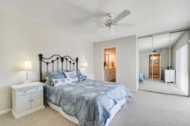 a bedroom with a bed and a mirror