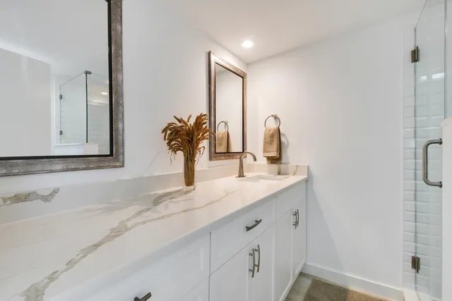 a bathroom with a sink and a mirror