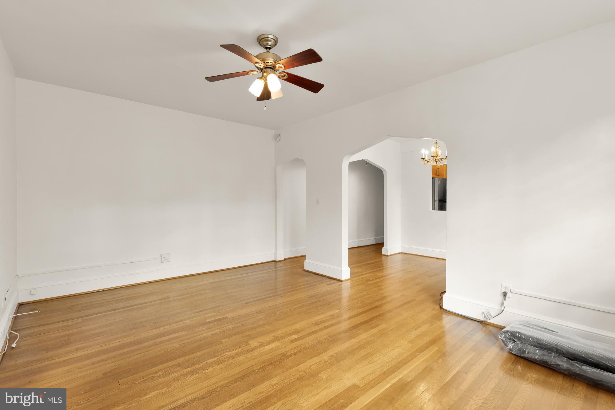 222 Farragut Street Northwest, Unit 204 Washington, DC 20011 - Photo 10 of 14 a view of a room with wooden floor and ceiling fan
