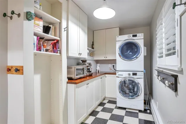 a utility room with sink dryer and washer