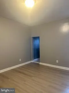 a kitchen with kitchen island granite countertop a sink stove and cabinets