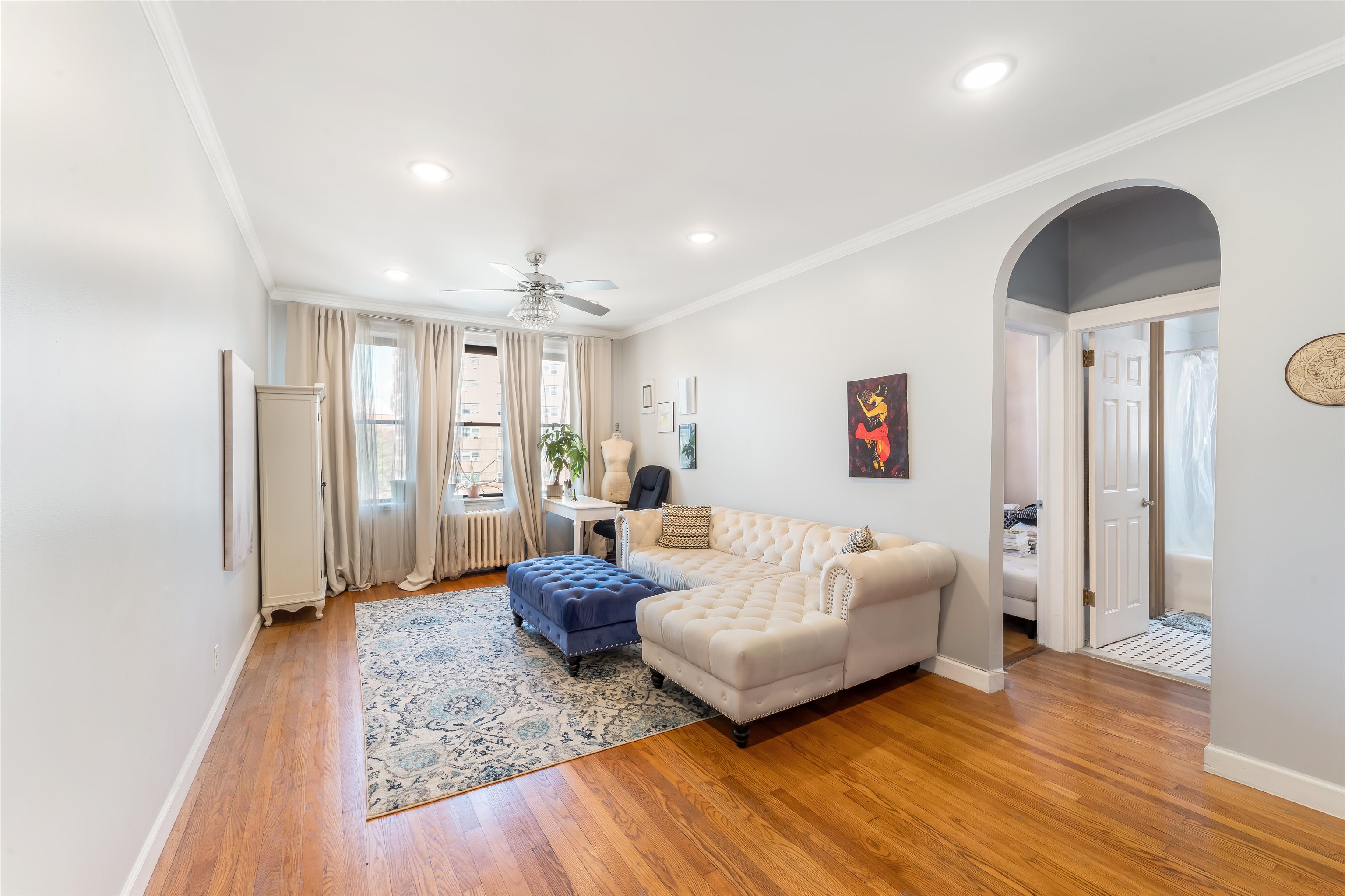 150 37th Street, Unit D4 Union City, NJ 07087 - Photo 1 of 22 a living room with furniture and a wooden floor