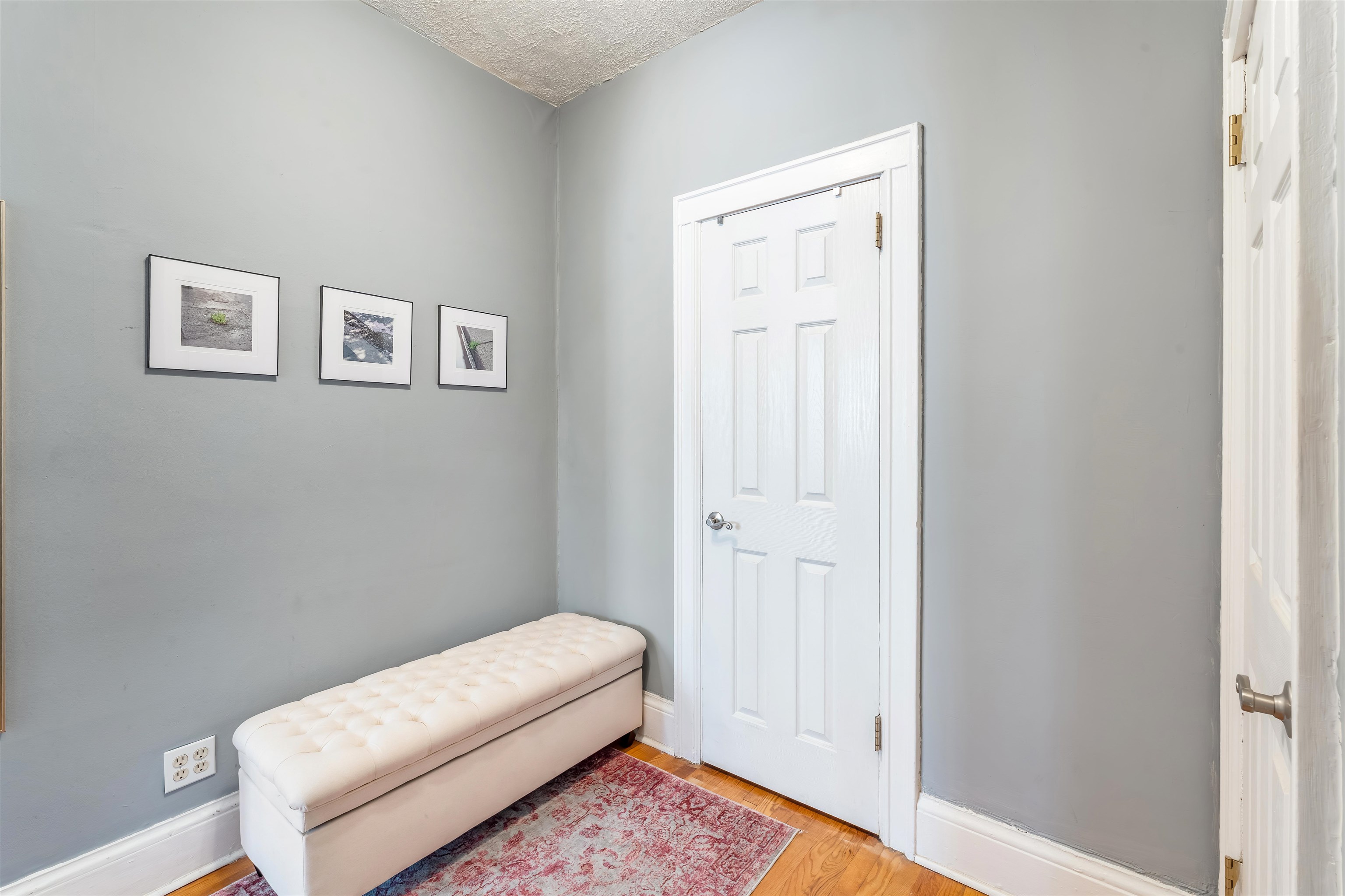 150 37th Street, Unit D4 Union City, NJ 07087 - Photo 12 of 22 a room with a bed and a painting on the wall
