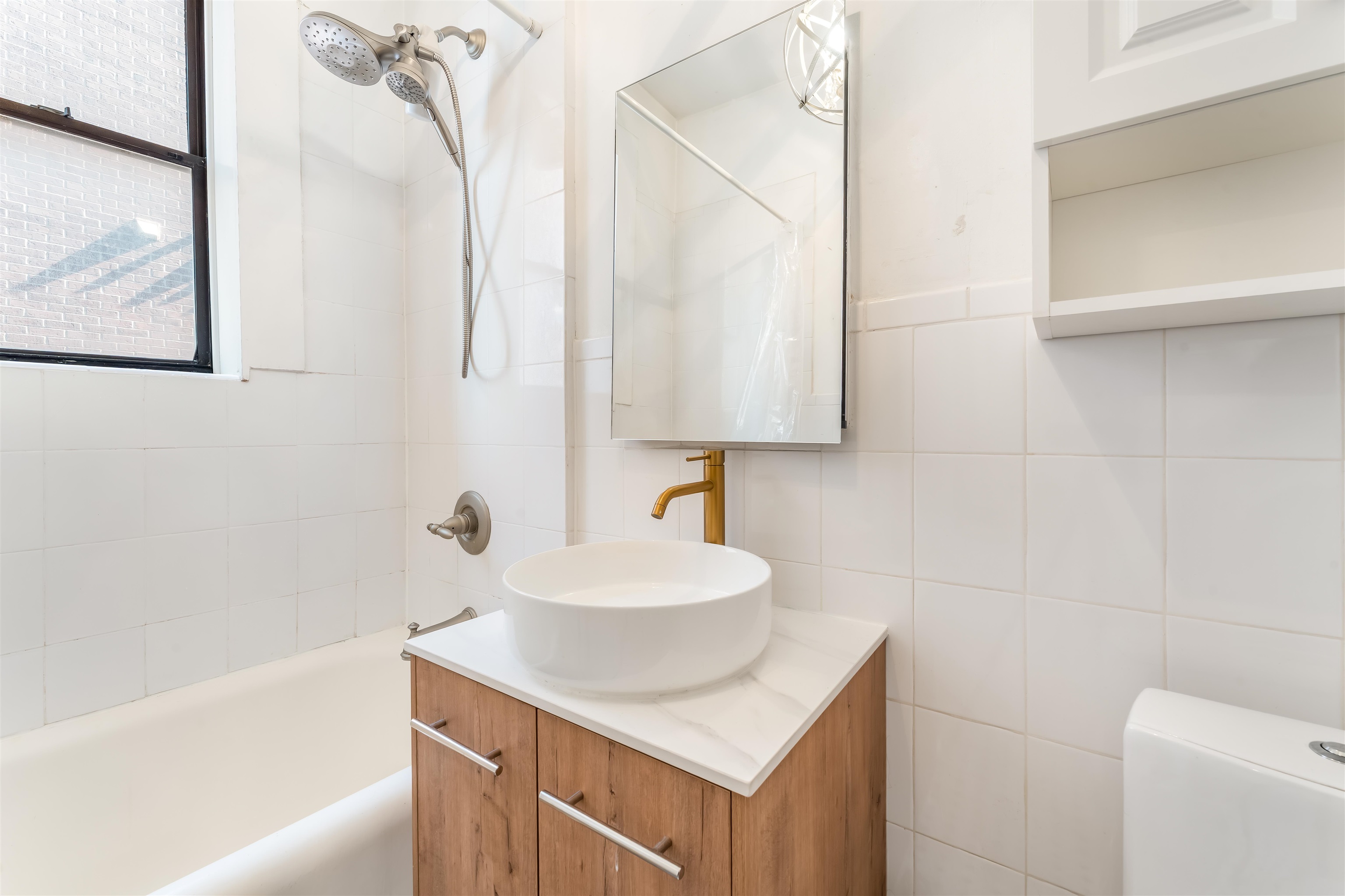 150 37th Street, Unit D4 Union City, NJ 07087 - Photo 13 of 22 a bathroom with a sink toilet and tub