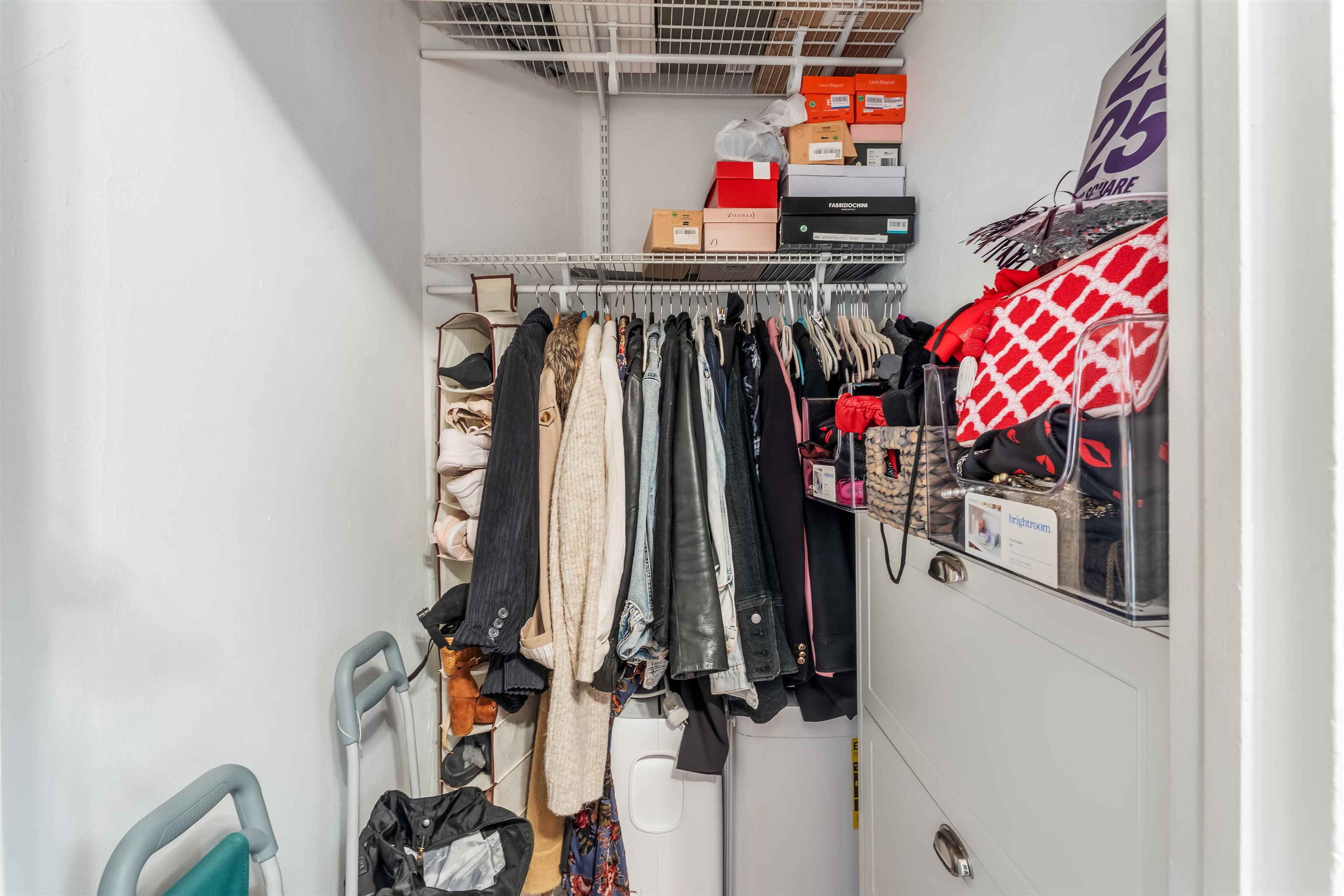 150 37th Street, Unit D4 Union City, NJ 07087 - Photo 14 of 22 a view of walk in closet with clothes and shoes