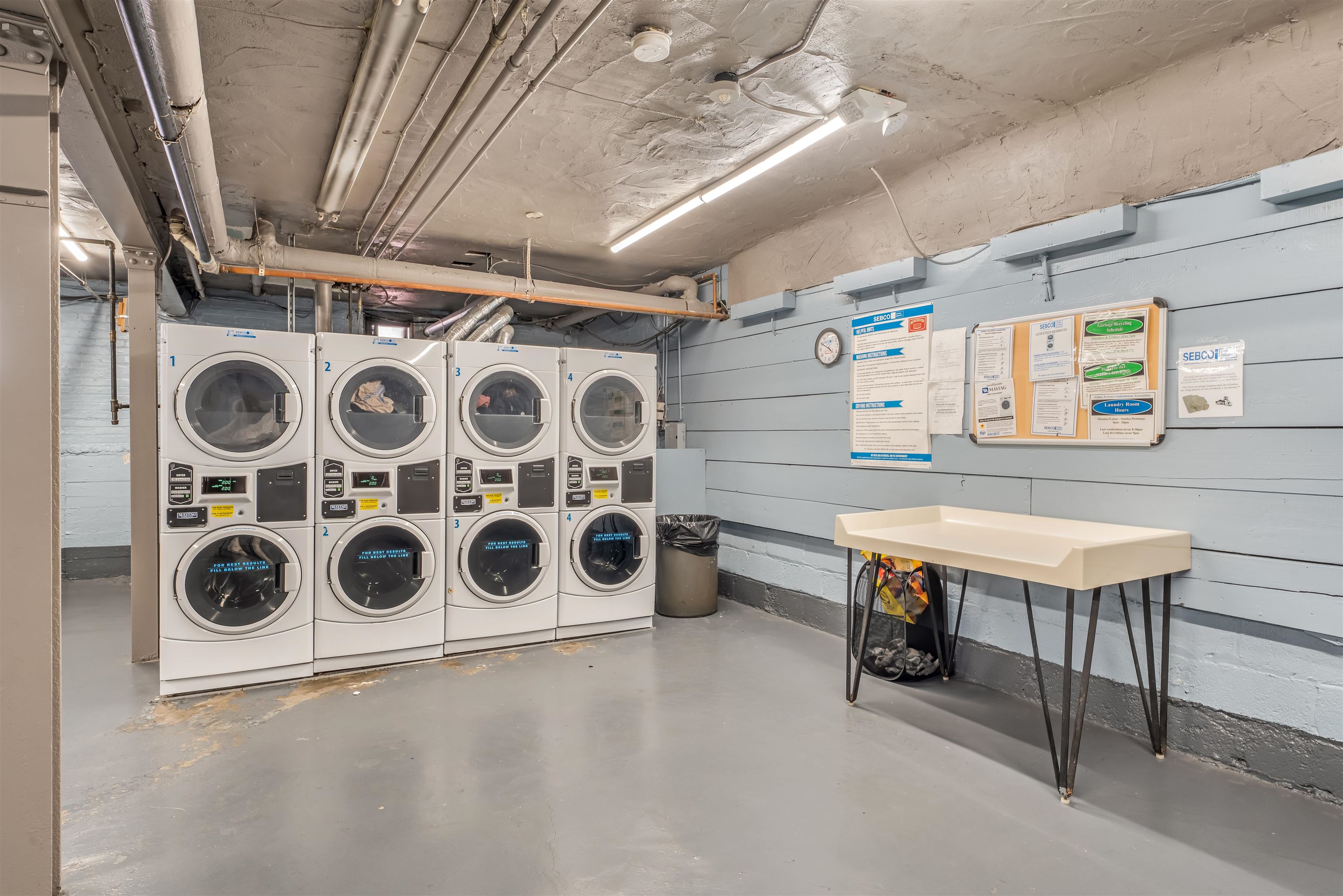 150 37th Street, Unit D4 Union City, NJ 07087 - Photo 18 of 22 a utility room with stainless steel appliances wooden cabinets and wooden floor