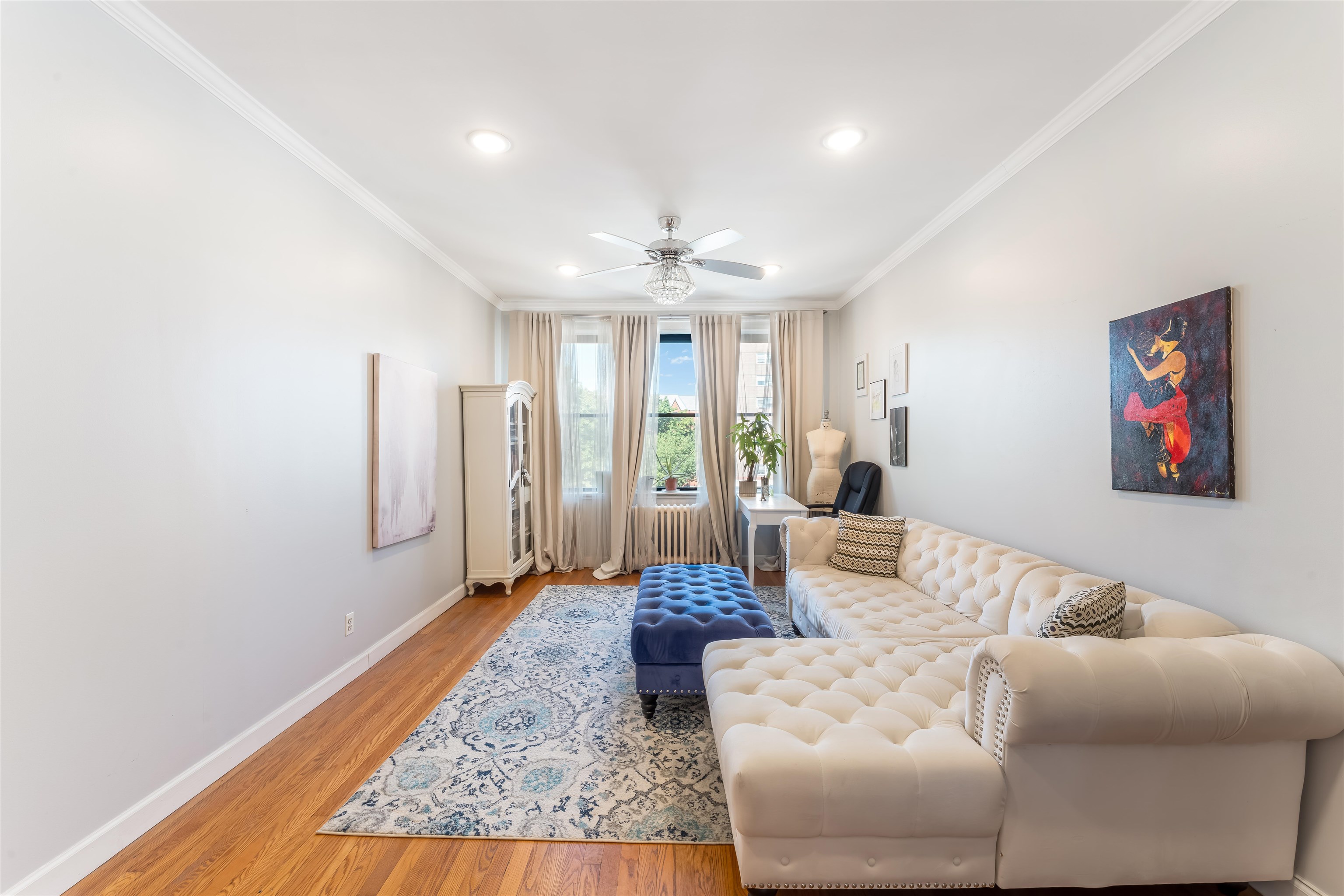 150 37th Street, Unit D4 Union City, NJ 07087 - Photo 8 of 22 a living room with furniture and a chandelier
