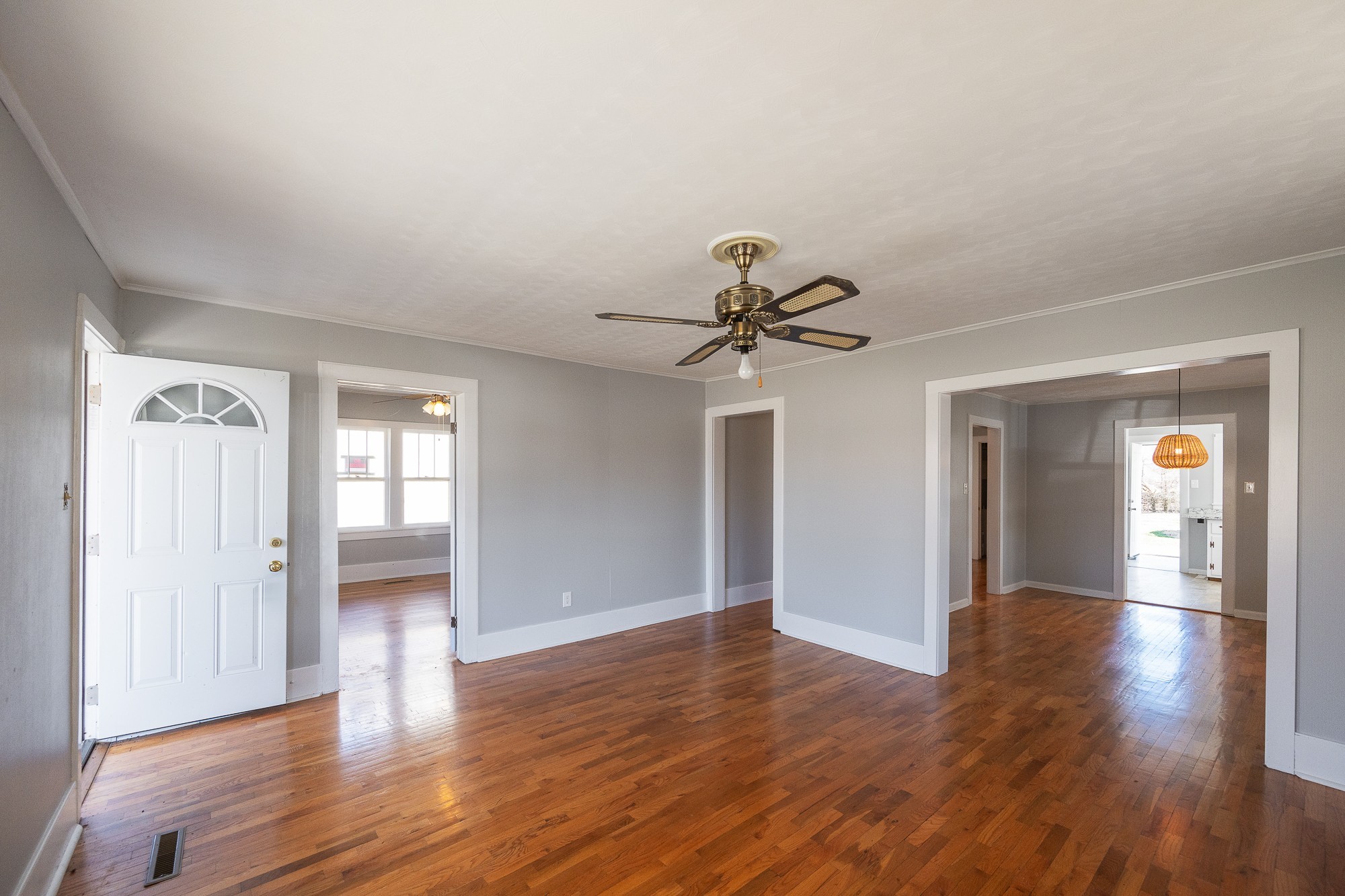 1213 Perryville Road Parsons, TN 38363 - Photo 13 of 32 a view of empty room with wooden floor and fan