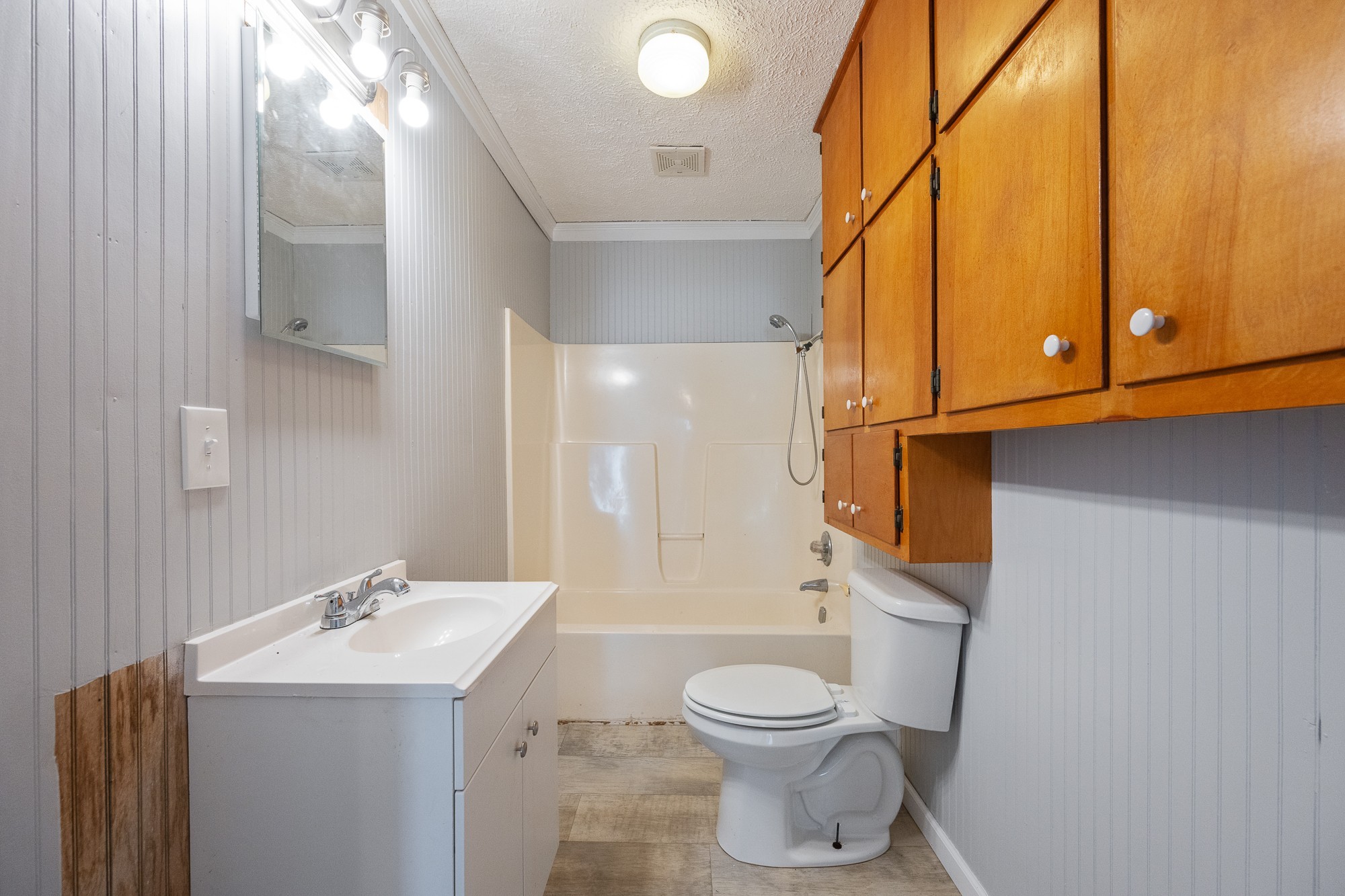 1213 Perryville Road Parsons, TN 38363 - Photo 25 of 32 a bathroom with a sink a toilet and shower