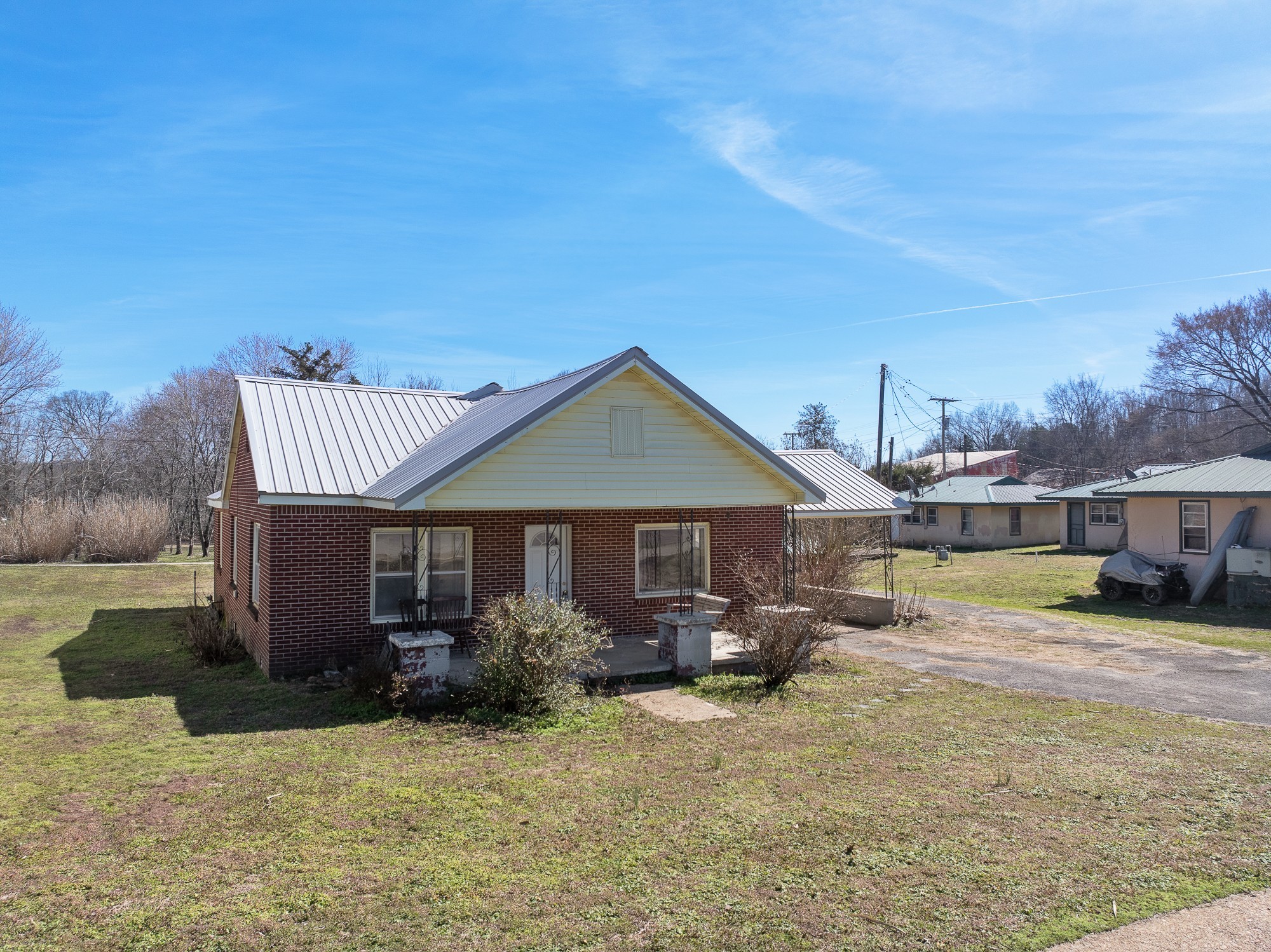 1213 Perryville Road Parsons, TN 38363 - Photo 28 of 32 a front view of a house with garden