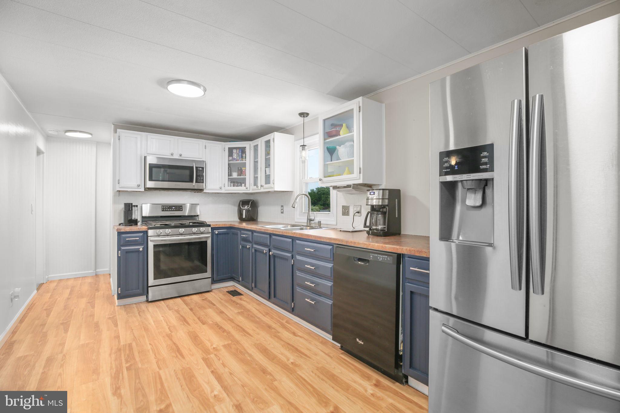 6181 3rd Street King George, VA 22485 - Photo 4 of 39 Gleaming flooring throughout kitchen