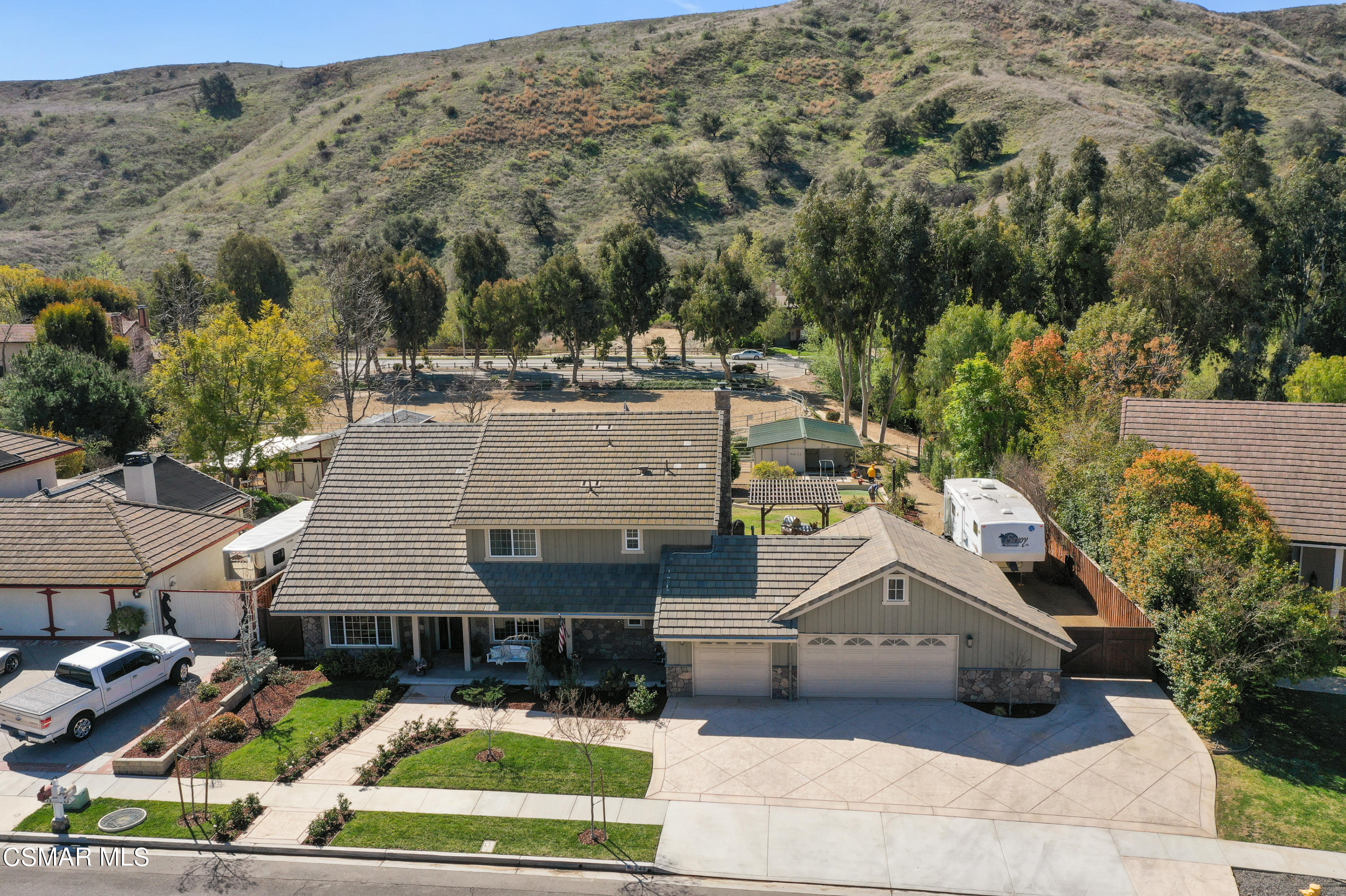 243 Longbranch Road Simi Valley, CA 93065 - Photo 11 of 77 an aerial view of a house with swimming pool and large trees