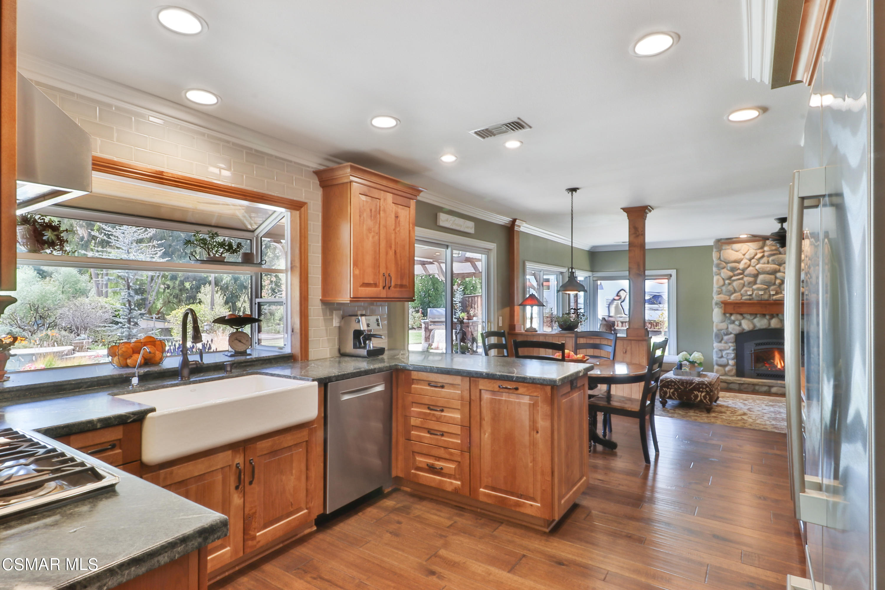 243 Longbranch Road Simi Valley, CA 93065 - Photo 22 of 77 a kitchen with lots of counter top space and living room