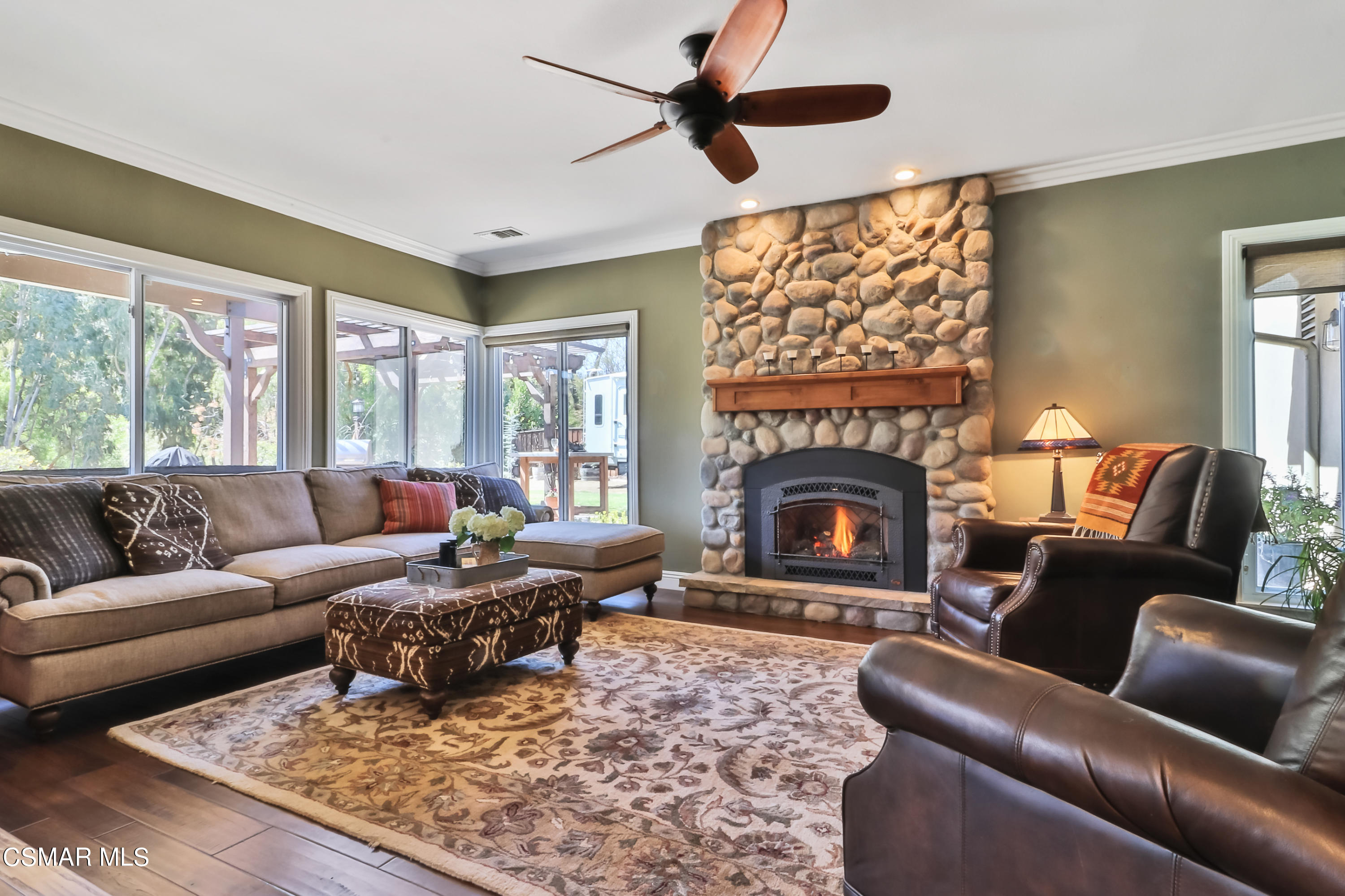 243 Longbranch Road Simi Valley, CA 93065 - Photo 26 of 77 a living room with furniture a rug and a fireplace