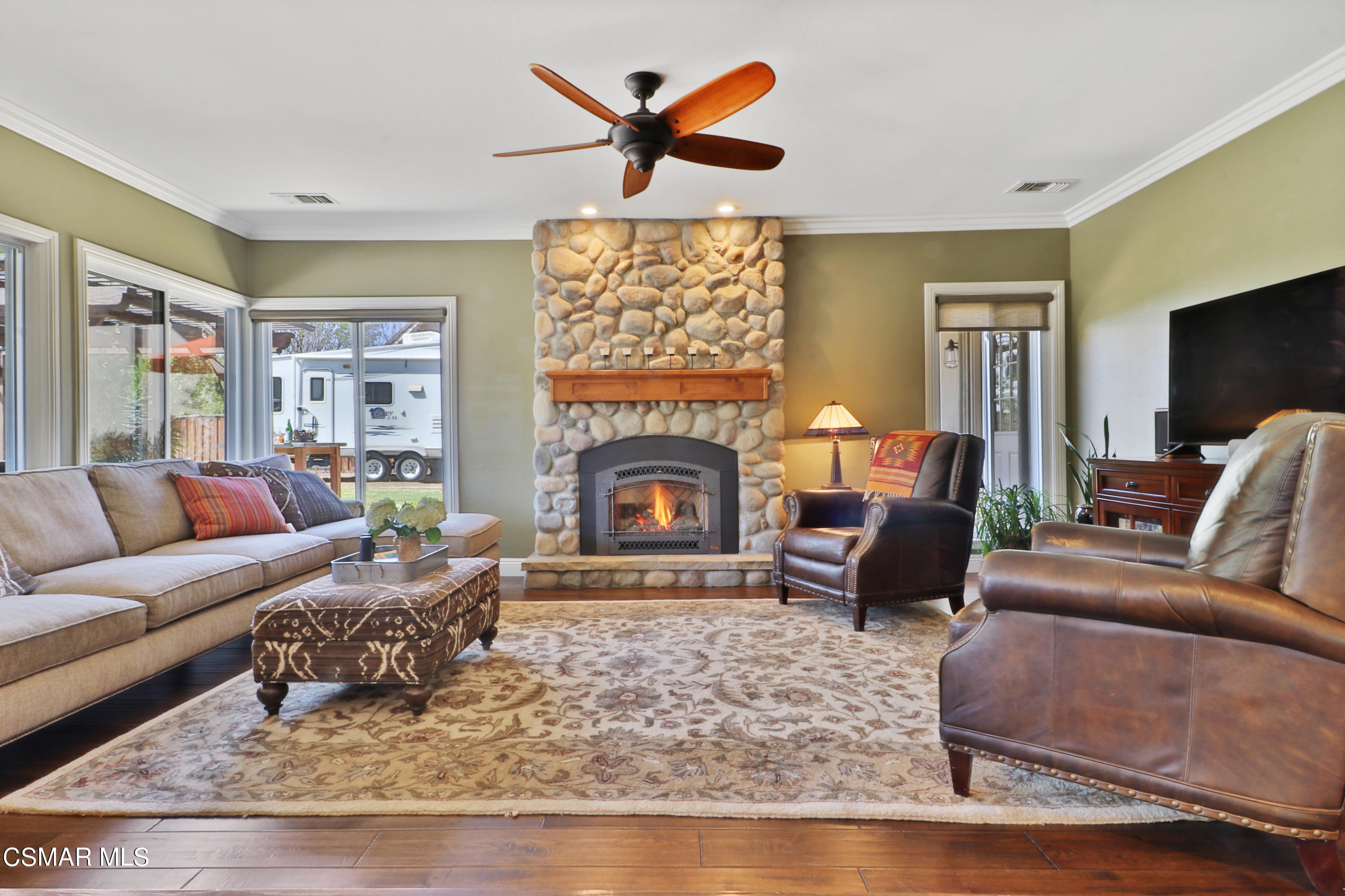 243 Longbranch Road Simi Valley, CA 93065 - Photo 27 of 77 a living room with furniture a fireplace and a flat screen tv