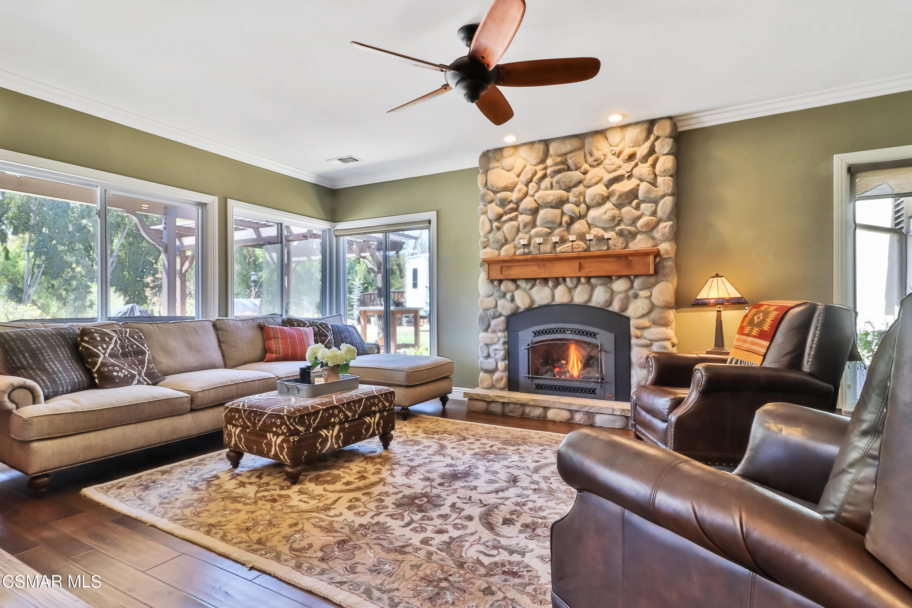 243 Longbranch Road Simi Valley, CA 93065 - Photo 28 of 77 a living room with furniture a fireplace and a large window