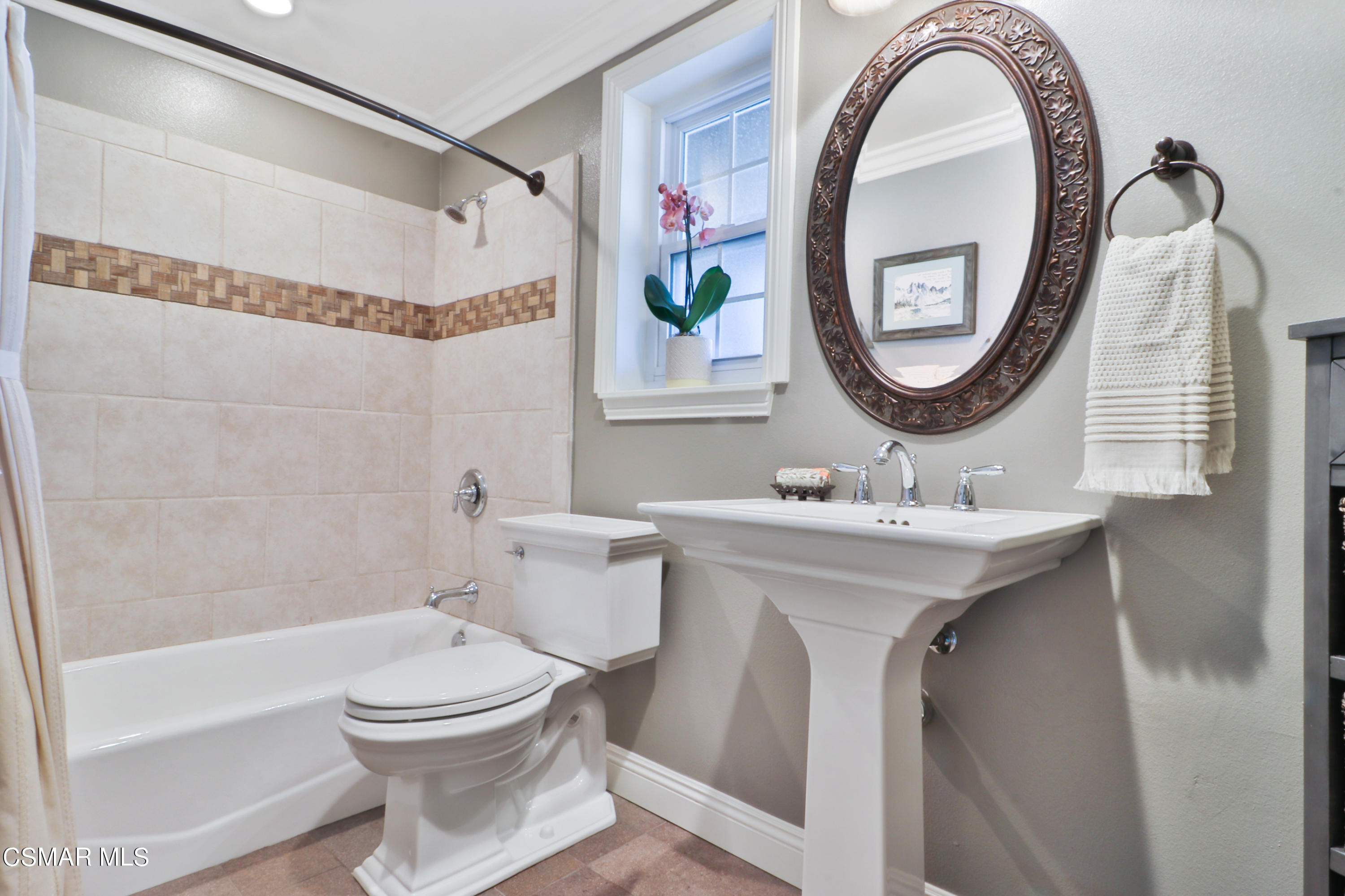 243 Longbranch Road Simi Valley, CA 93065 - Photo 30 of 77 a bathroom with a sink a mirror a toilet and a bathtub