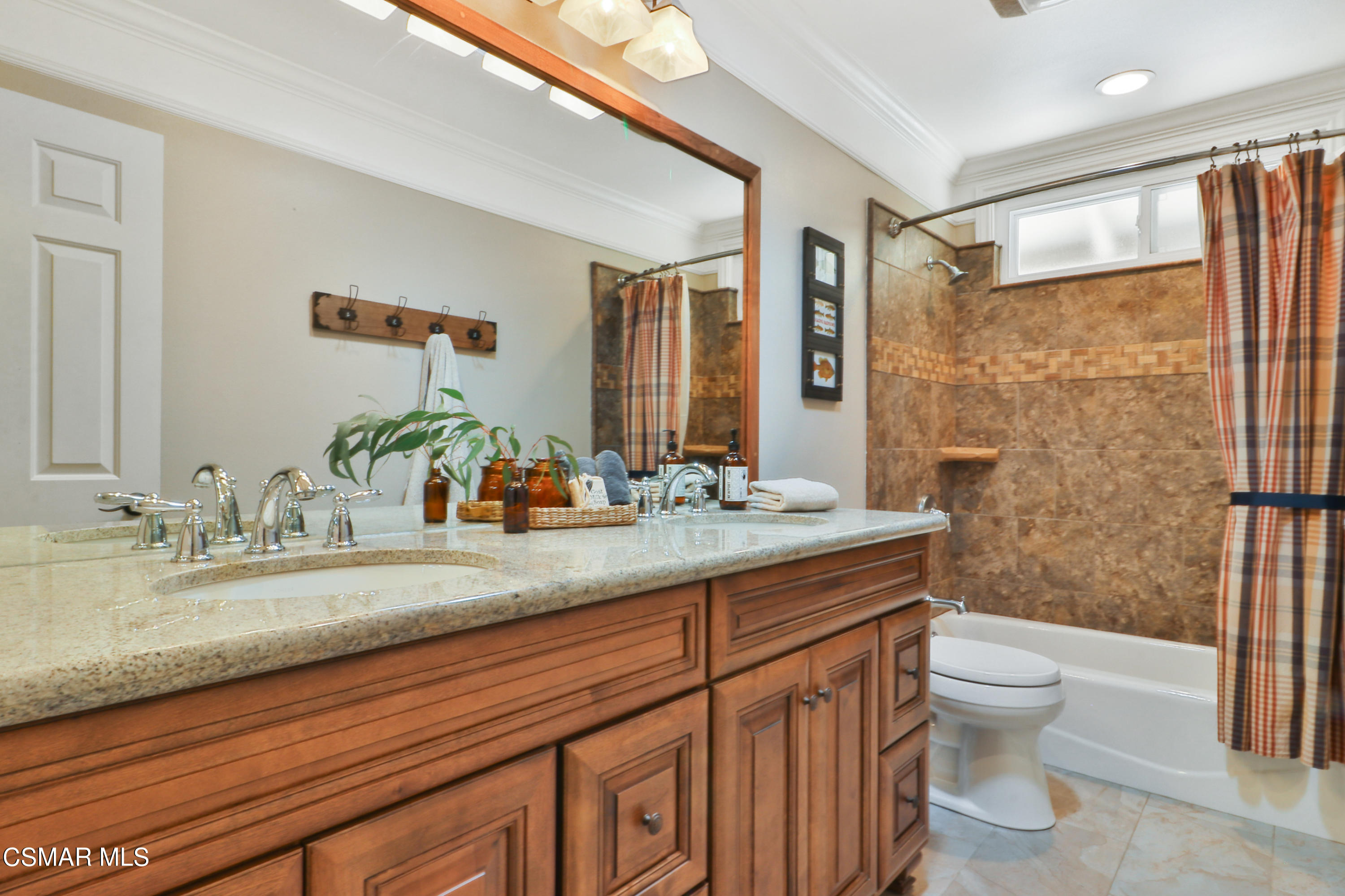 243 Longbranch Road Simi Valley, CA 93065 - Photo 36 of 77 a bathroom with a granite countertop sink a toilet a mirror and shower
