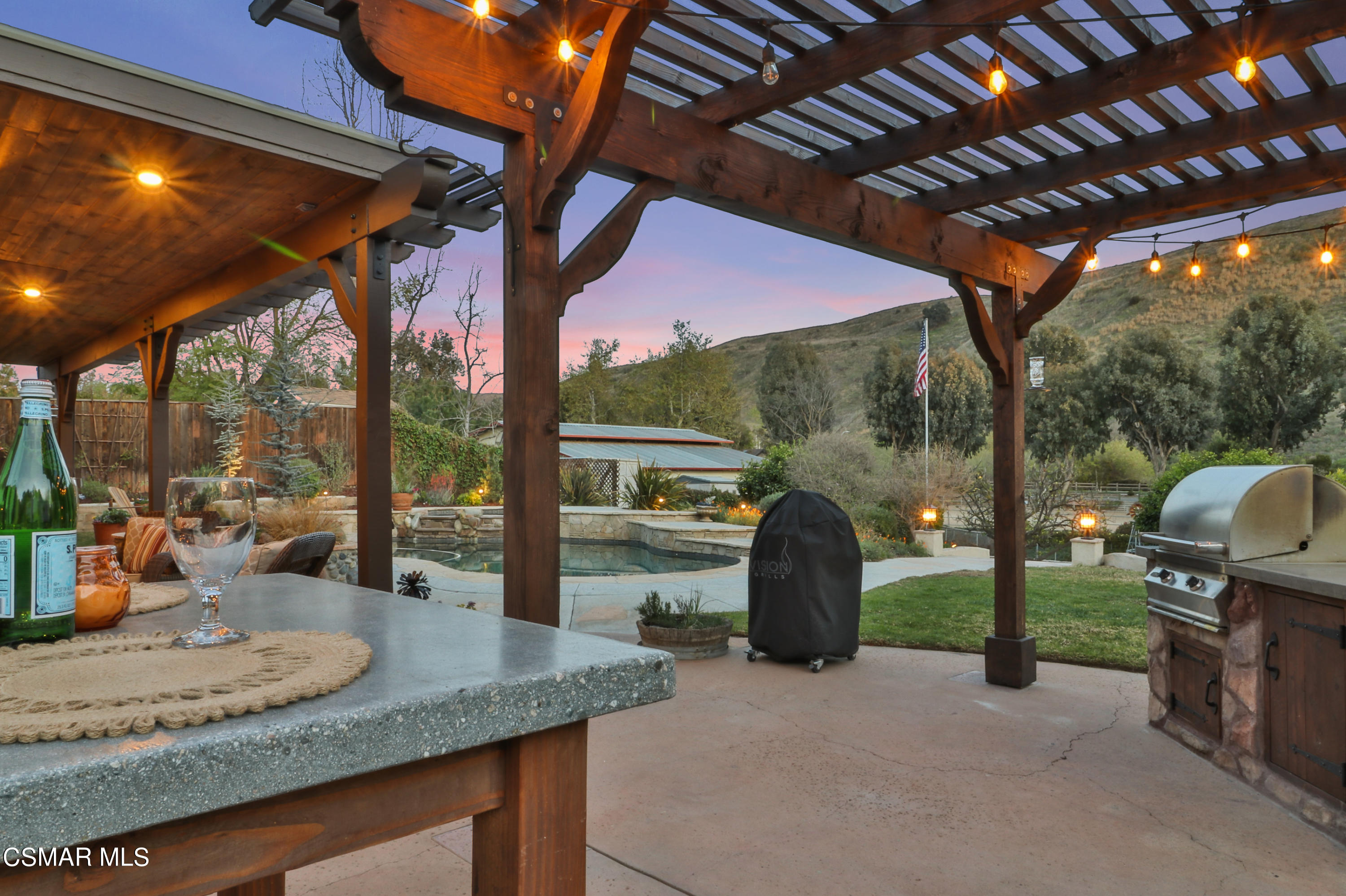 243 Longbranch Road Simi Valley, CA 93065 - Photo 58 of 77 a view of porch with a table and chairs under an umbrella