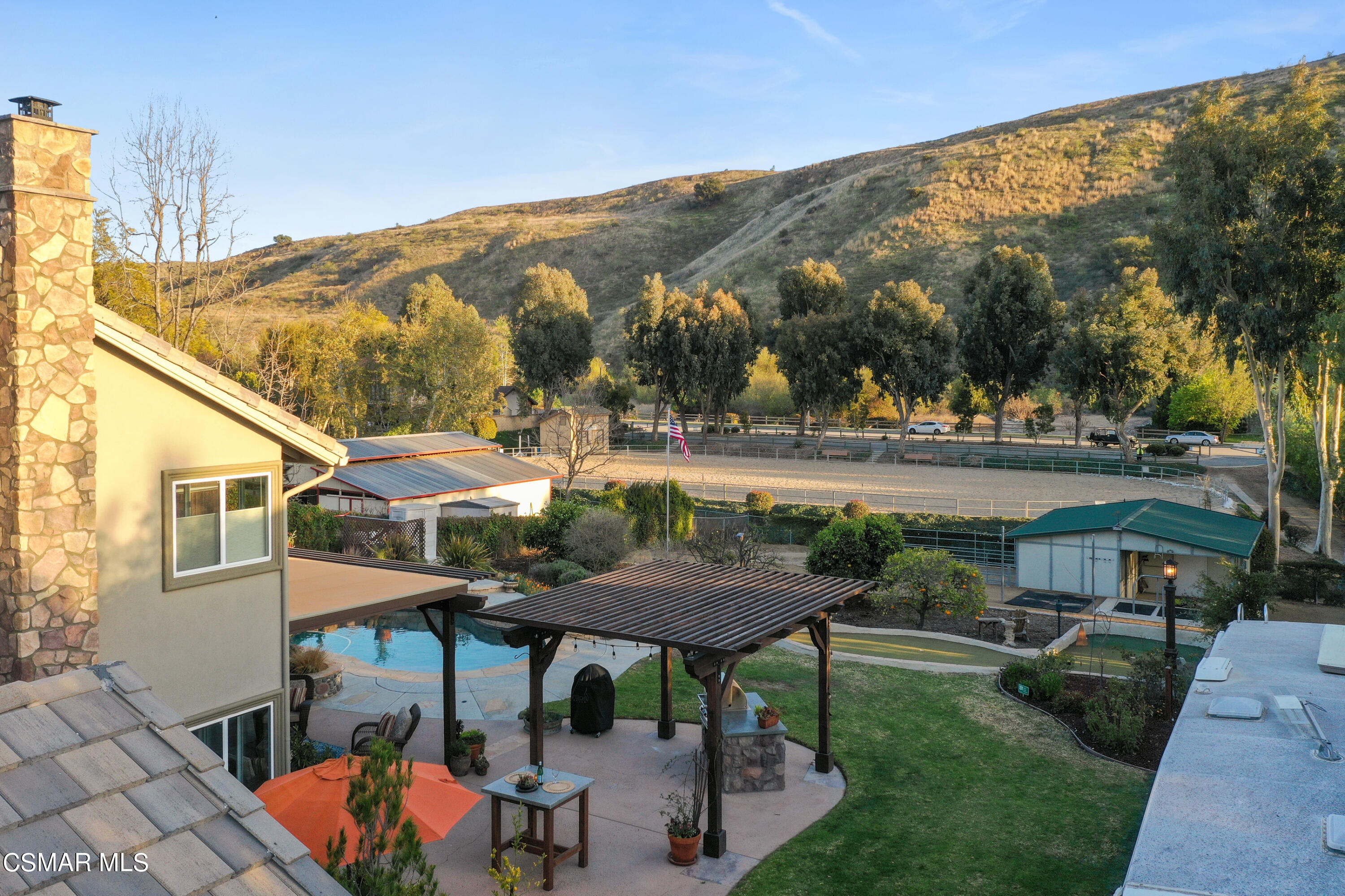 243 Longbranch Road Simi Valley, CA 93065 - Photo 65 of 77 a view of a patio with furniture and a backyard