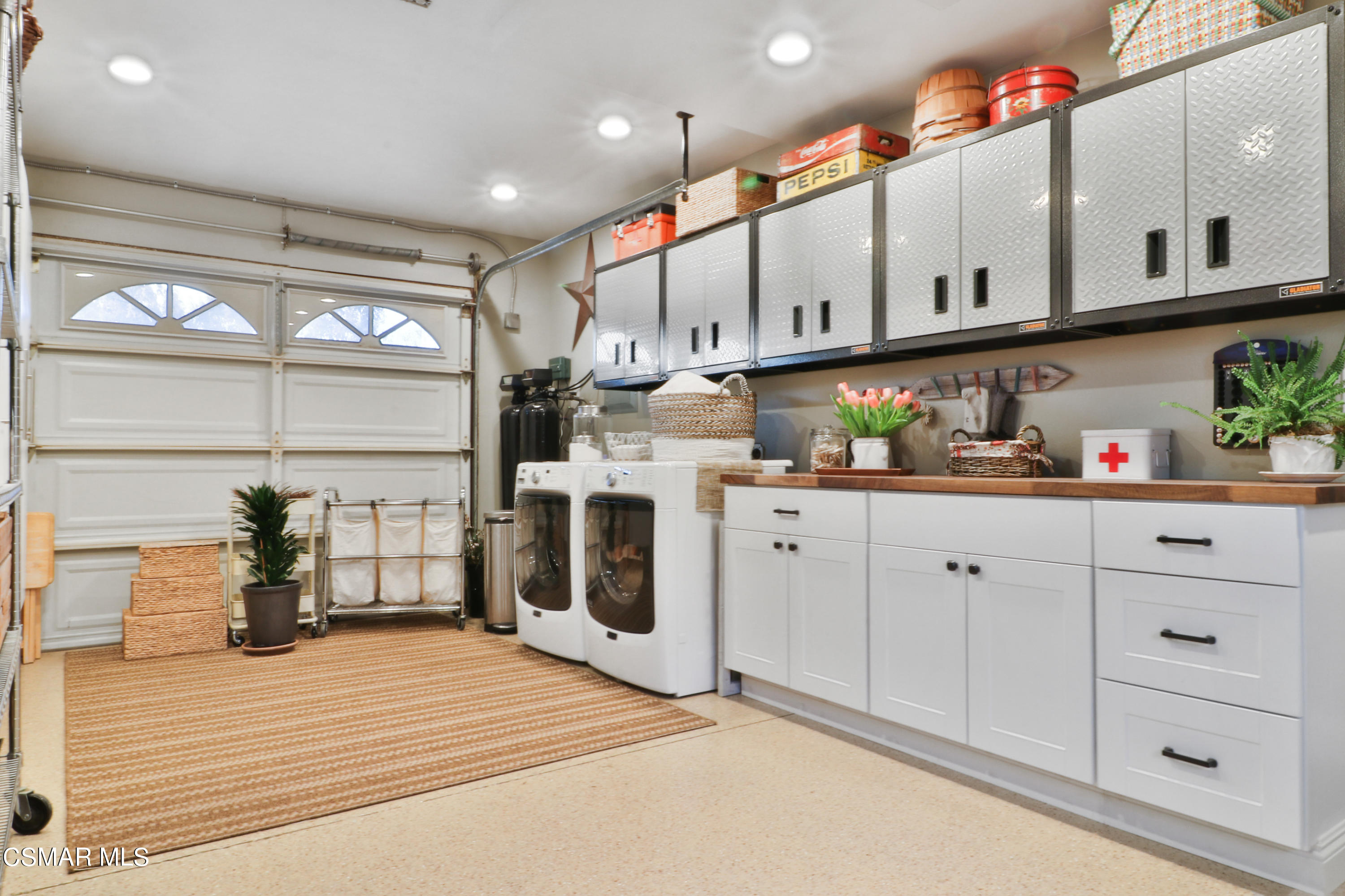 243 Longbranch Road Simi Valley, CA 93065 - Photo 71 of 77 a kitchen with stainless steel appliances granite countertop a stove a sink and white cabinets