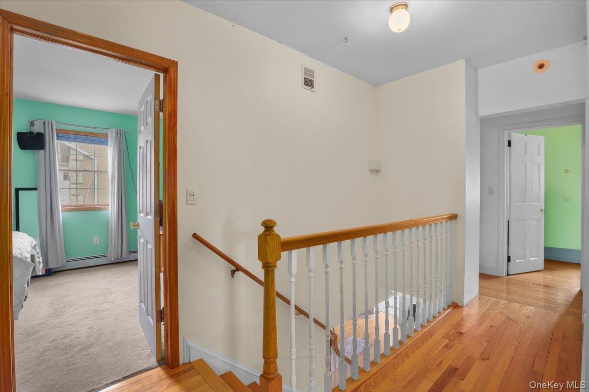 74 White Road Scarsdale, NY 10583 - Photo 15 of 27 a view of a hallway with staircase