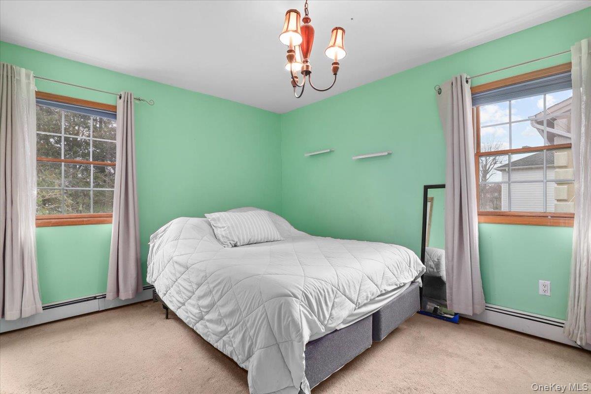 74 White Road Scarsdale, NY 10583 - Photo 16 of 27 a bedroom with a bed and window