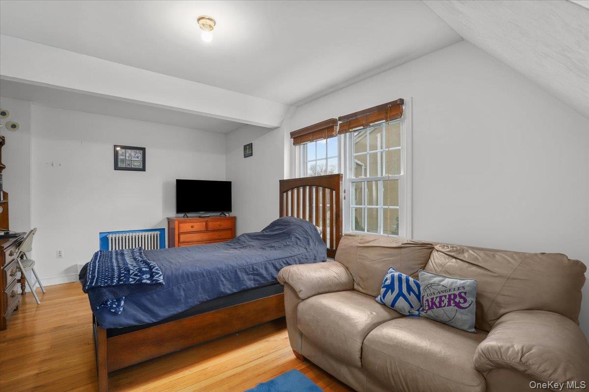 74 White Road Scarsdale, NY 10583 - Photo 17 of 27 a living room with a couch and a flat screen tv