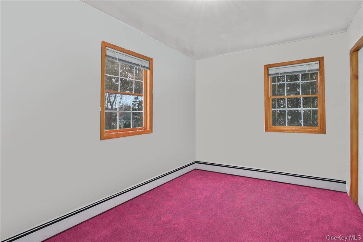 74 White Road Scarsdale, NY 10583 - Photo 19 of 27 an empty room with windows