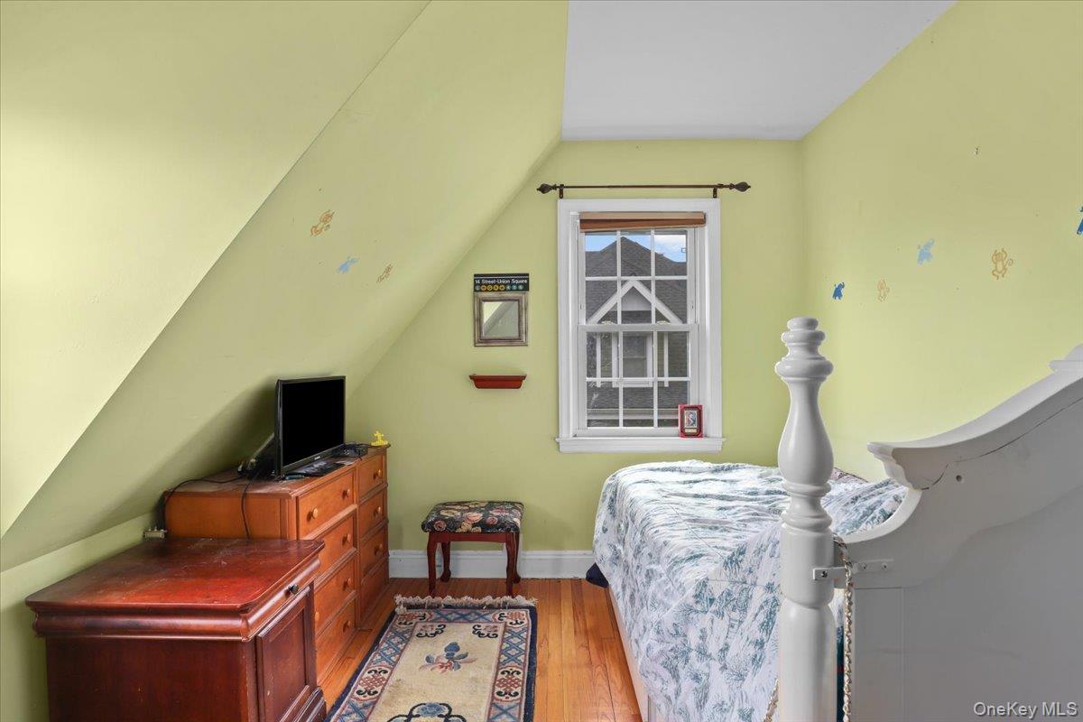 74 White Road Scarsdale, NY 10583 - Photo 20 of 27 a living room with furniture and a flat screen tv