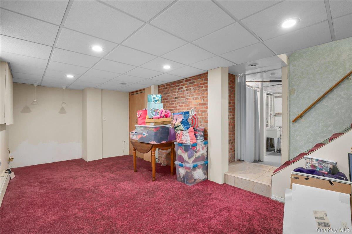 74 White Road Scarsdale, NY 10583 - Photo 21 of 27 a livingroom with furniture and a stove