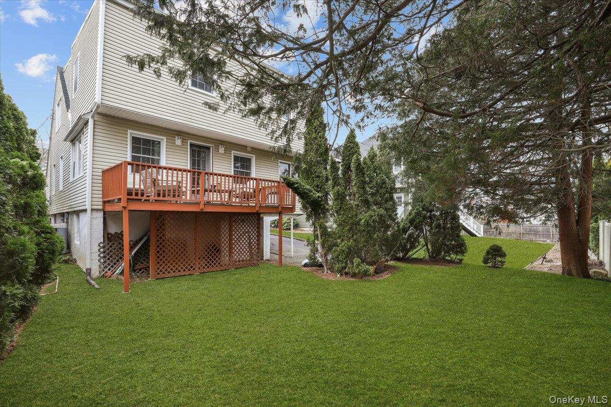 74 White Road Scarsdale, NY 10583 - Photo 22 of 27 a view of a house with a yard porch and sitting area