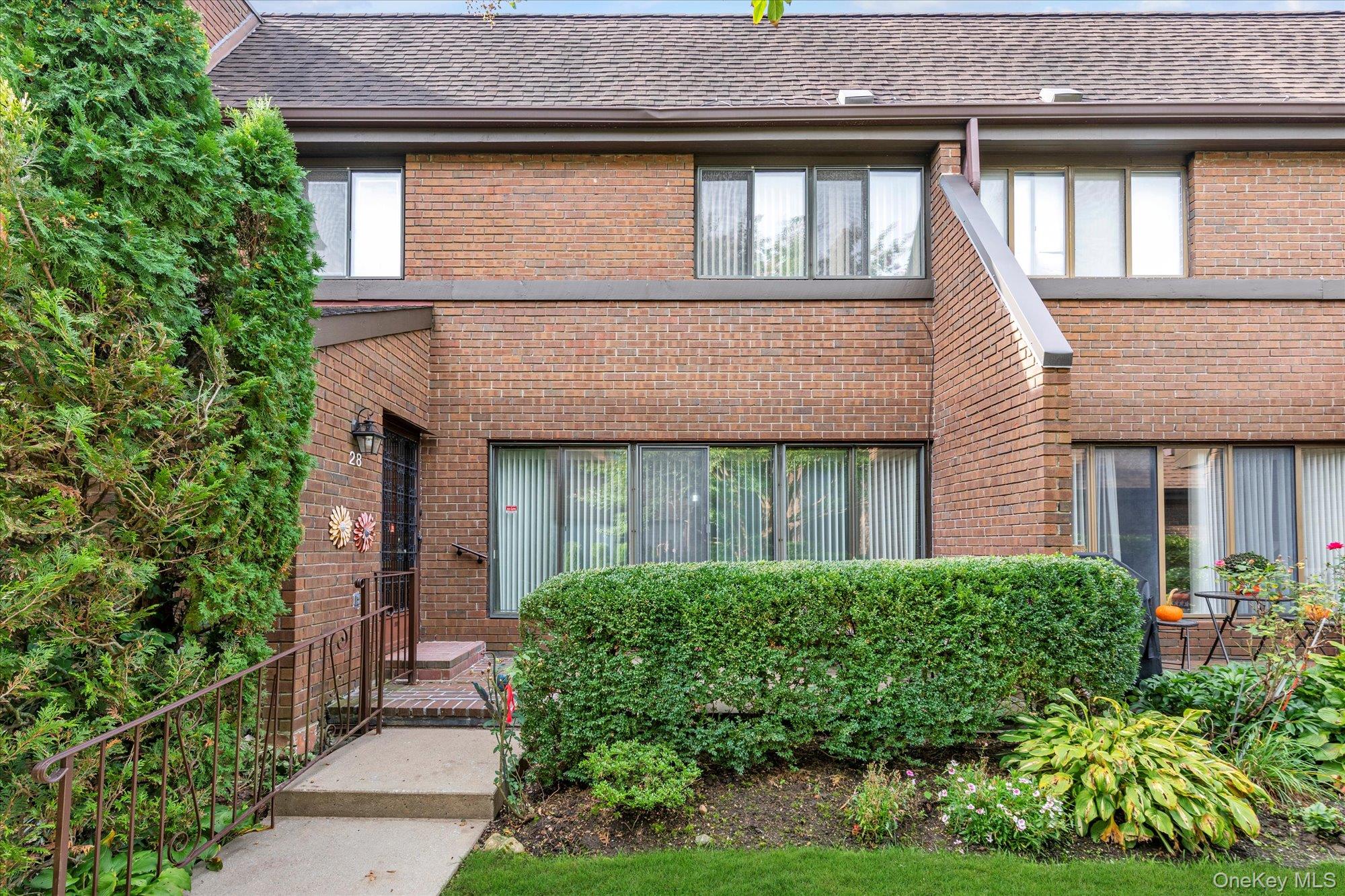 a house view with a garden space