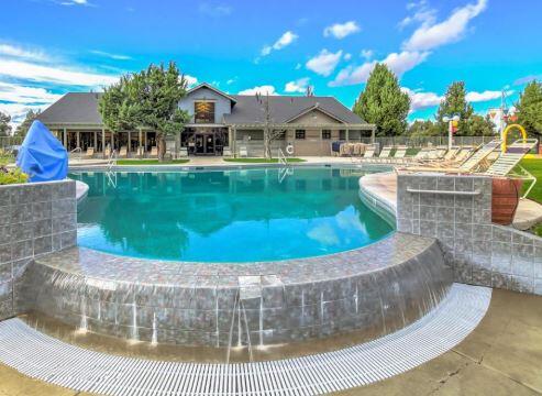 631 Sundance Ridge Court Redmond, OR 97756 - Photo 55 of 61 a view of a house with a swimming pool