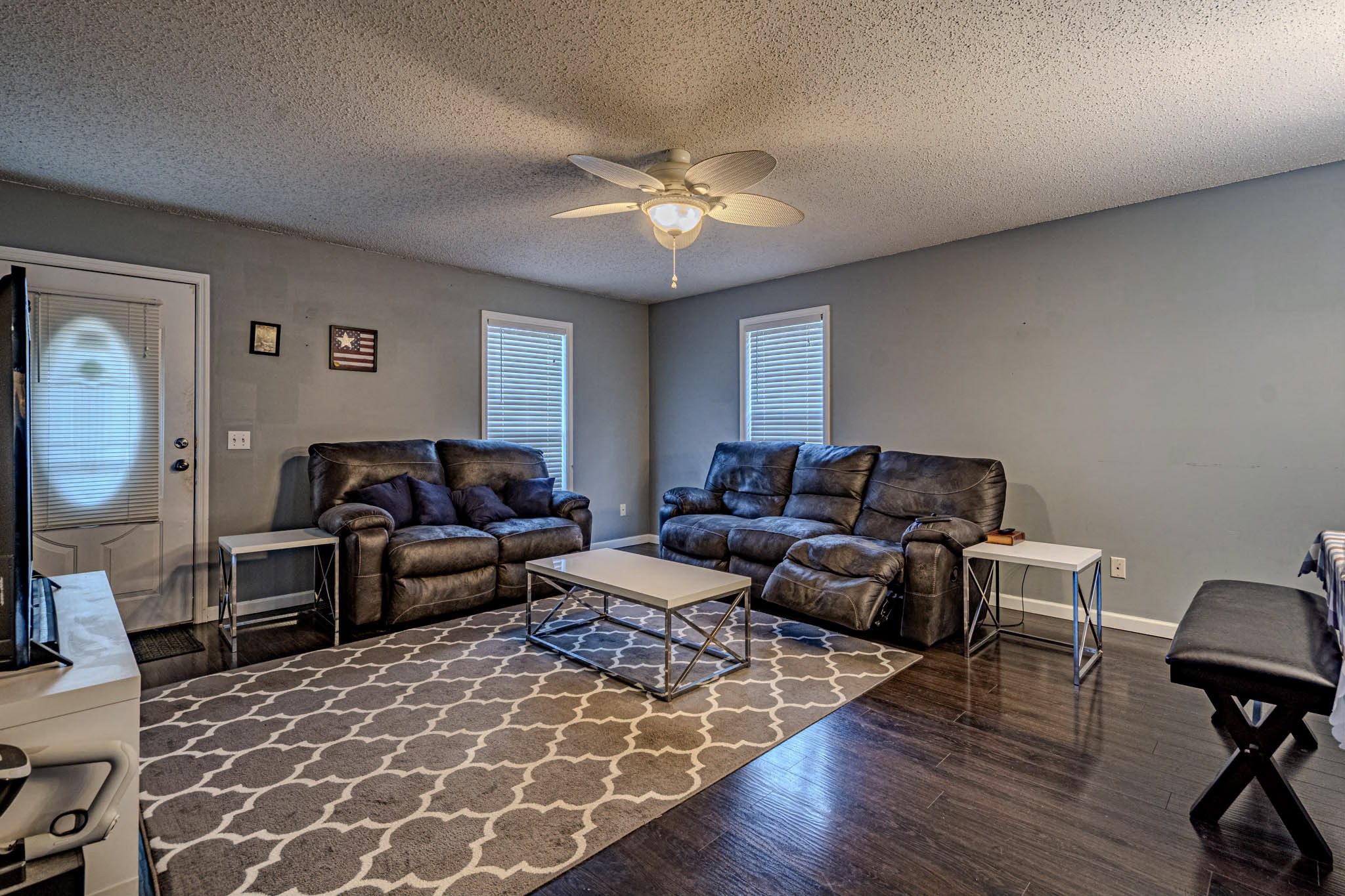 25230 Union Hill Road Ardmore, TN 38449 - Photo 19 of 55 a living room with furniture a two lamps and a wooden floor
