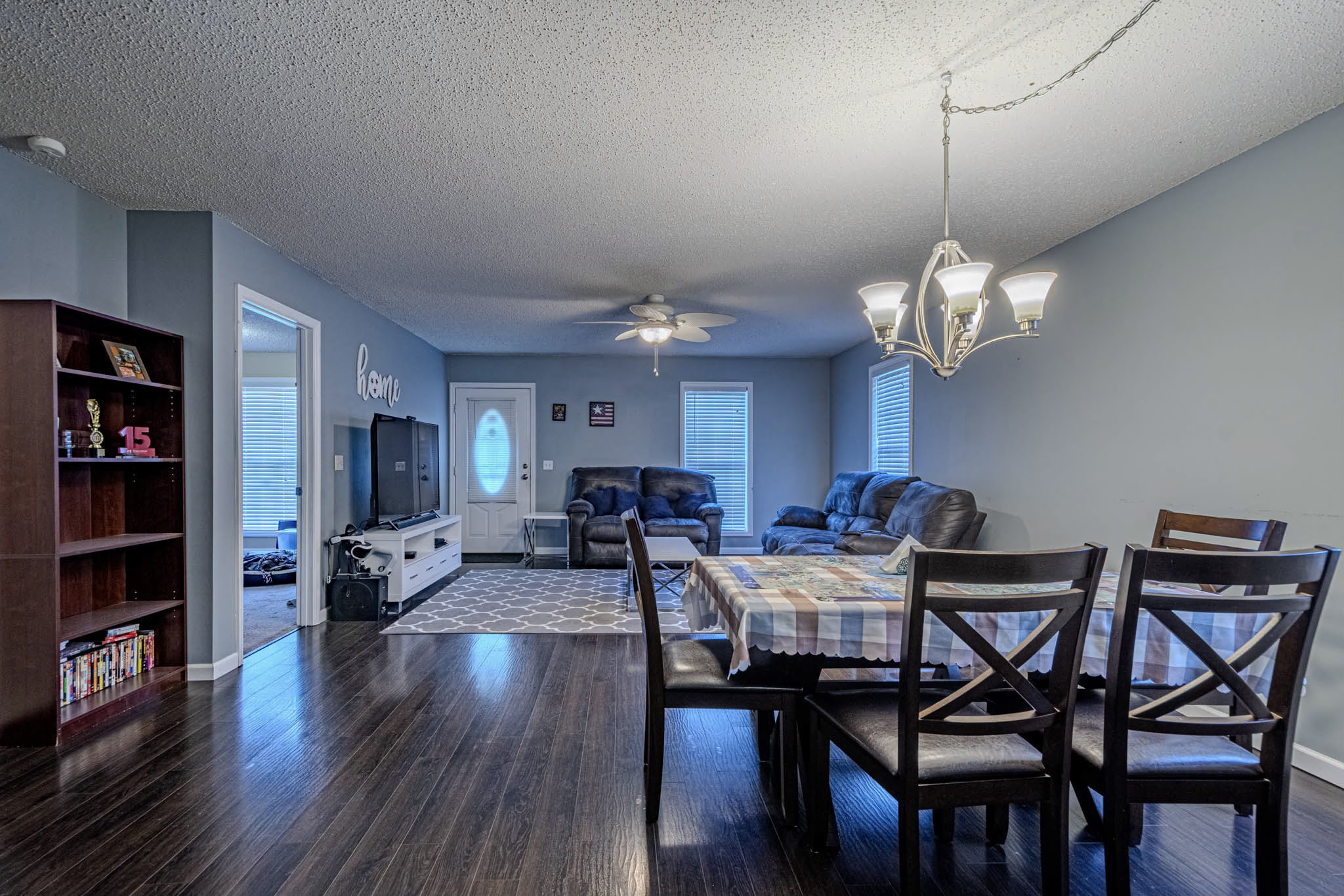 25230 Union Hill Road Ardmore, TN 38449 - Photo 23 of 55 a view of a dining room with furniture wooden floor and chandelier