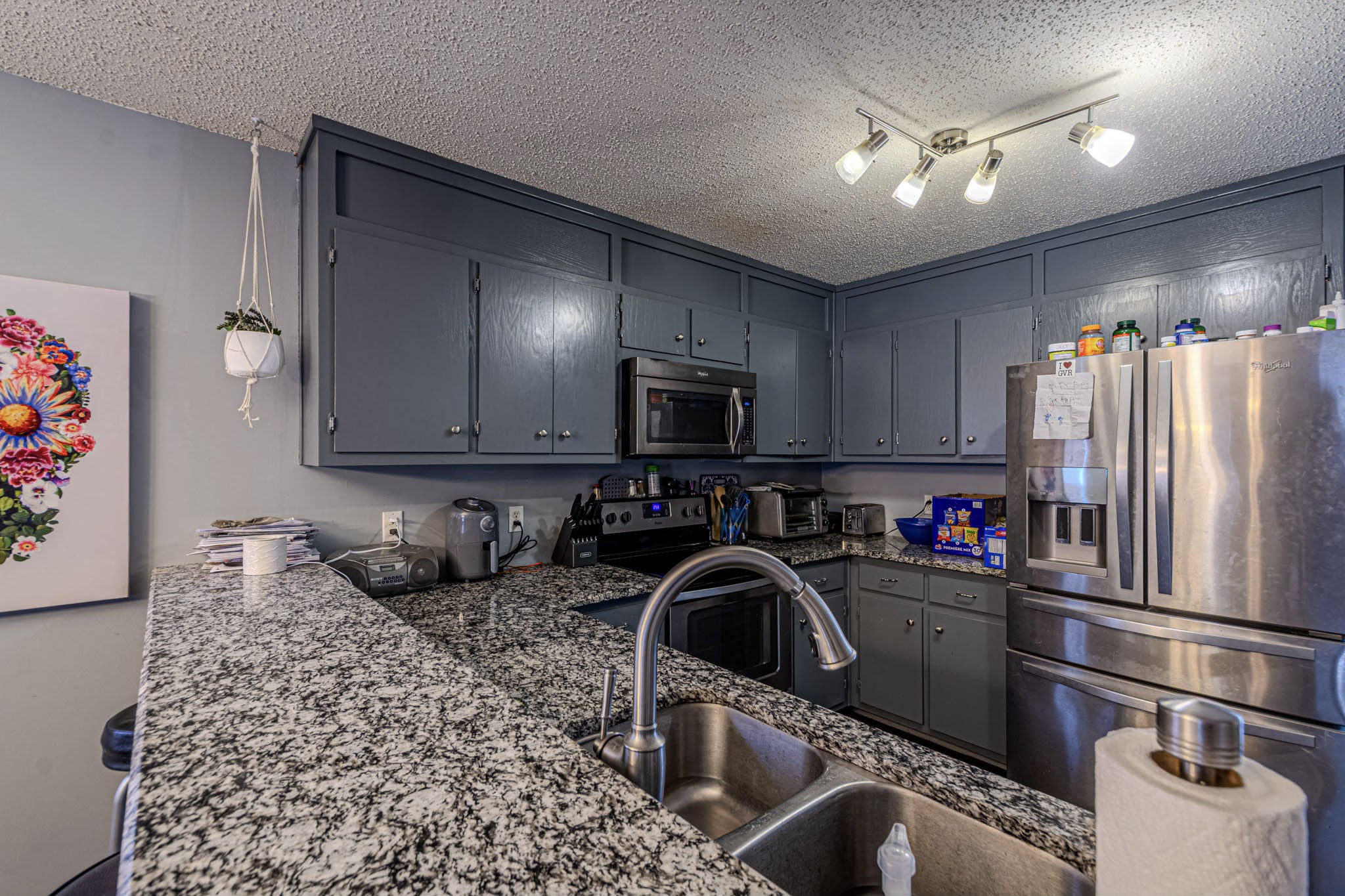 25230 Union Hill Road Ardmore, TN 38449 - Photo 32 of 55 a kitchen with stainless steel appliances granite countertop a refrigerator sink and stove