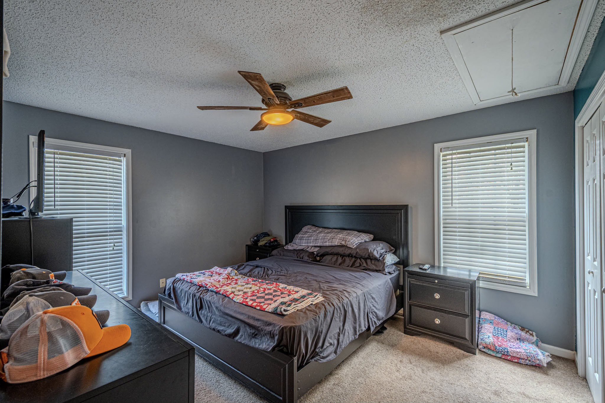 25230 Union Hill Road Ardmore, TN 38449 - Photo 33 of 55 a bedroom with a bed and a chandelier